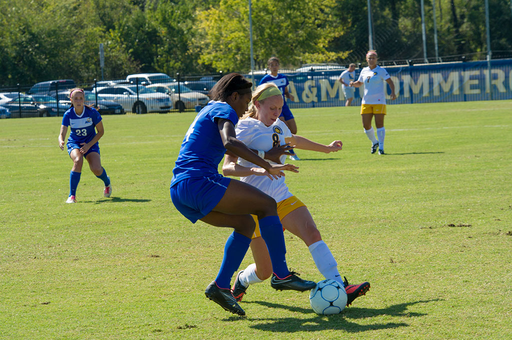 Junior Players playing Soccer Image